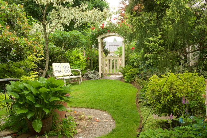 Secret garden gate entrance with arbor